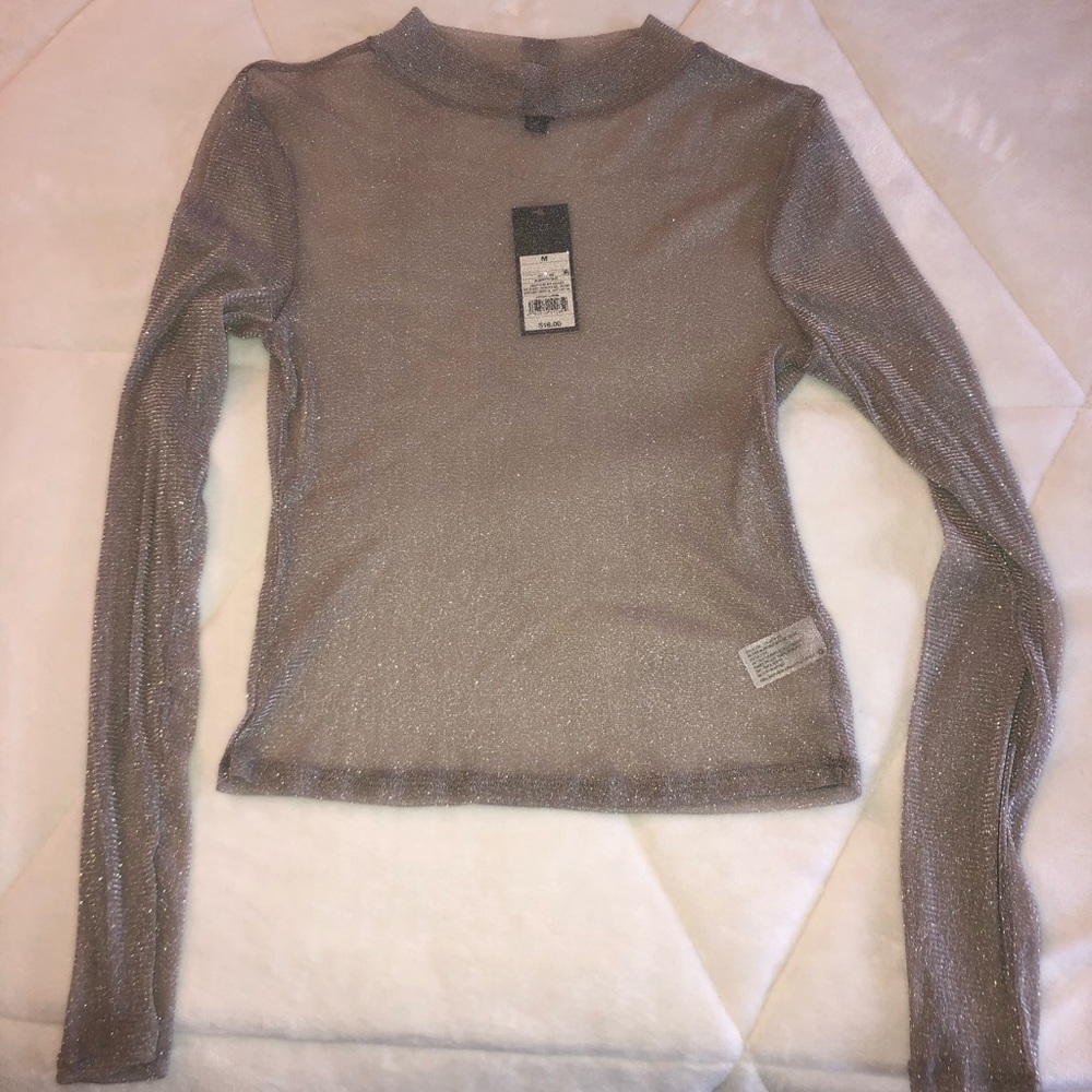 Sparkling long sleeve top.
